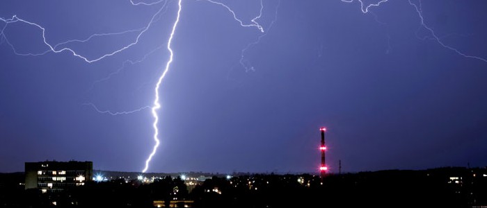 Lighting striking the city skyline at night