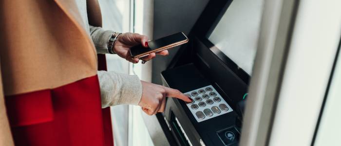 Women cashing out at ATM