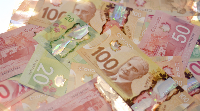 Pile of colourful Canadian money on a table