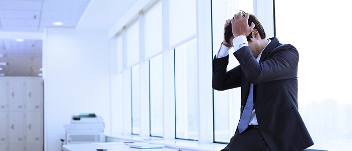 Stressed business man at work