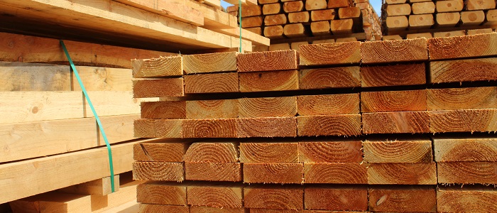 Piles of lumber on construction site