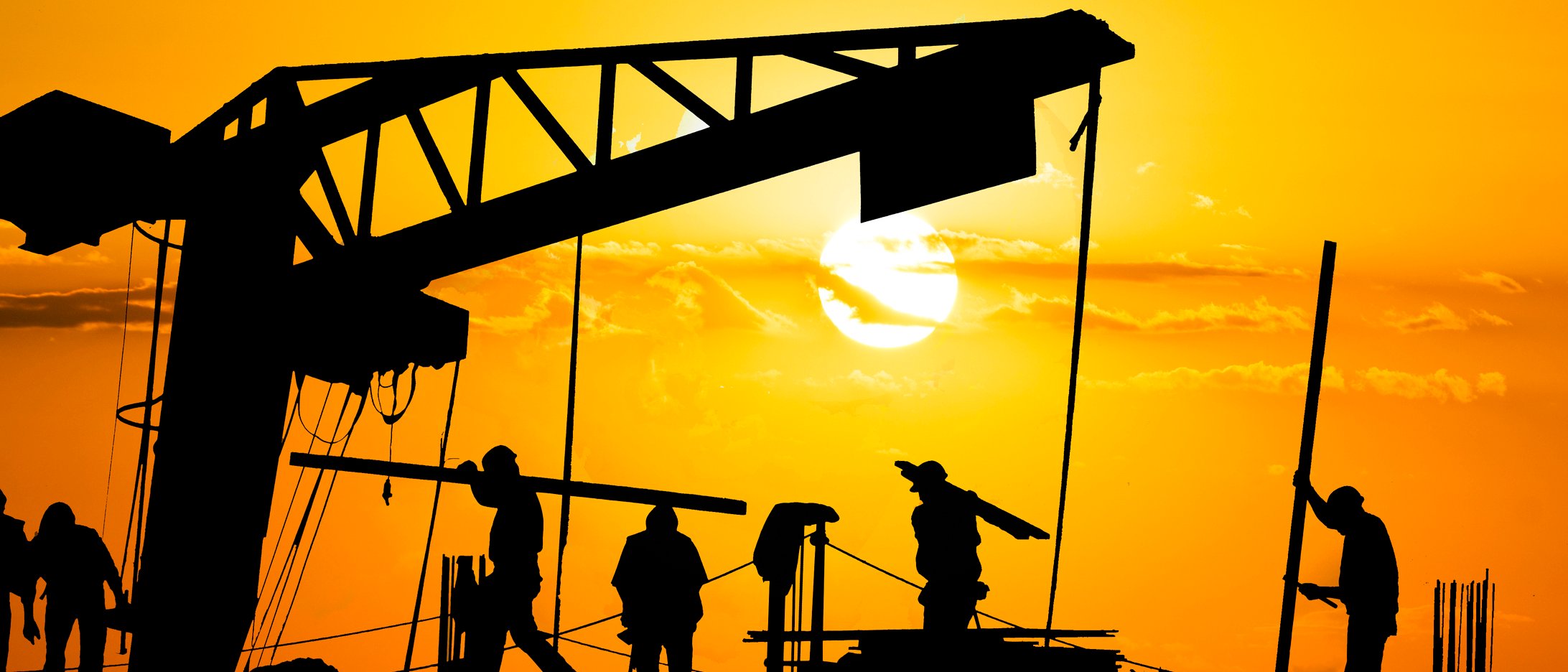 Construction workers on a site during hot sunny day