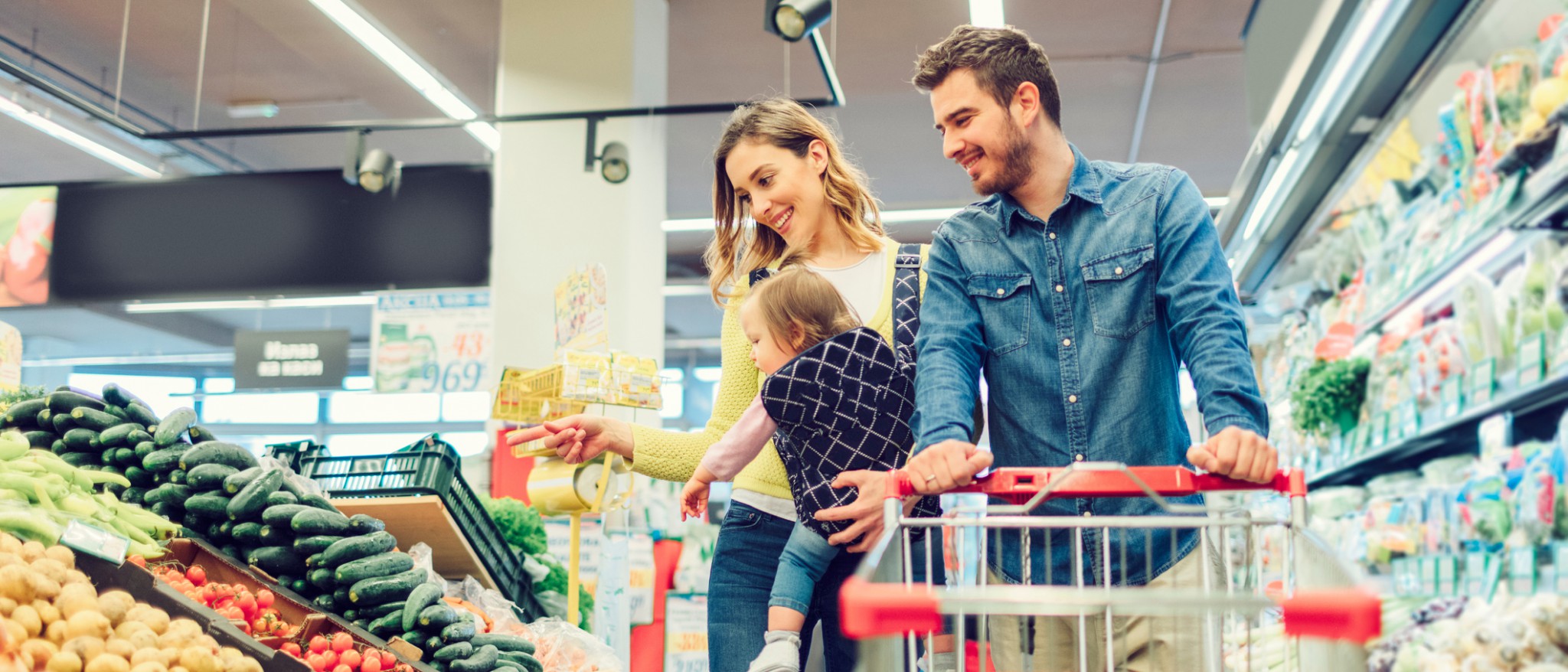 Family of 3 shopping in grocery store