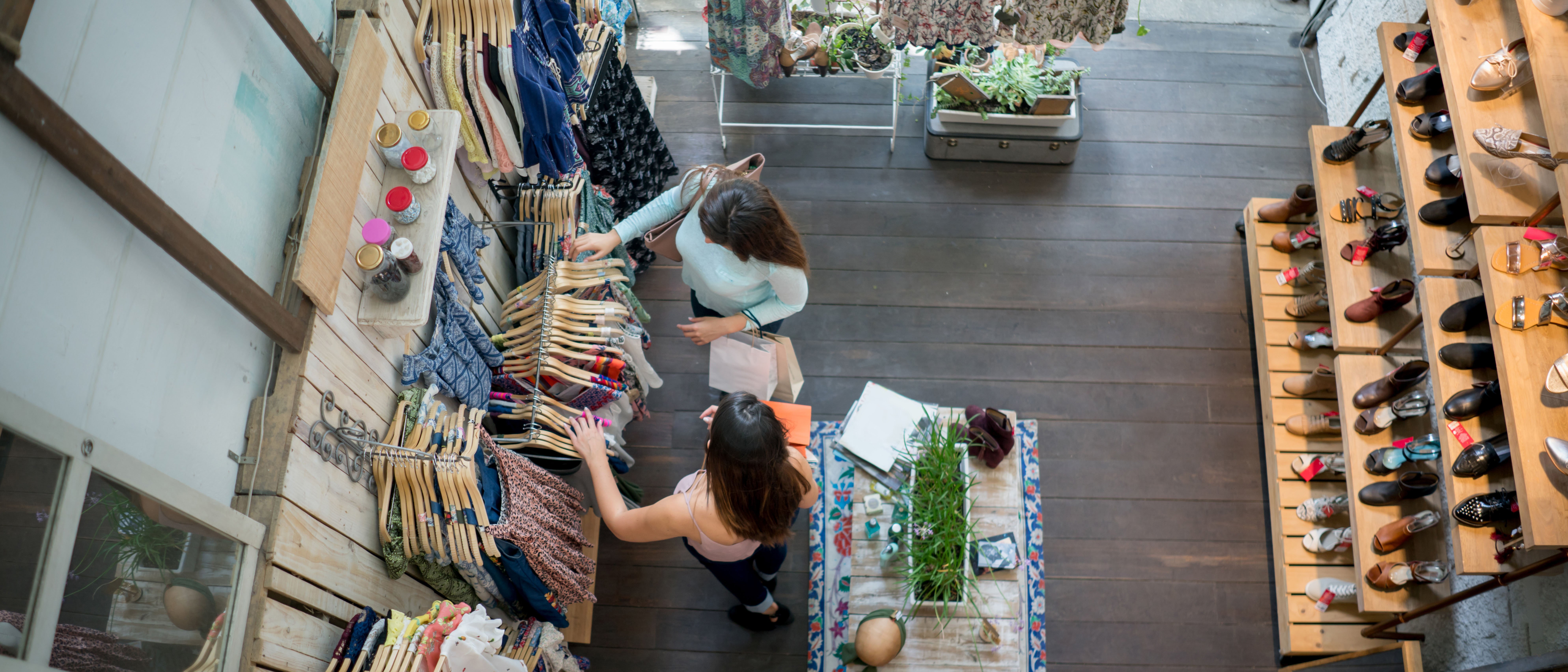 Two women shopping at a retail store