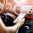 woman on cell phone while driving