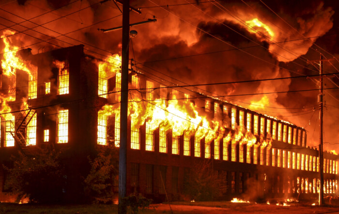 Old factory on fire at night