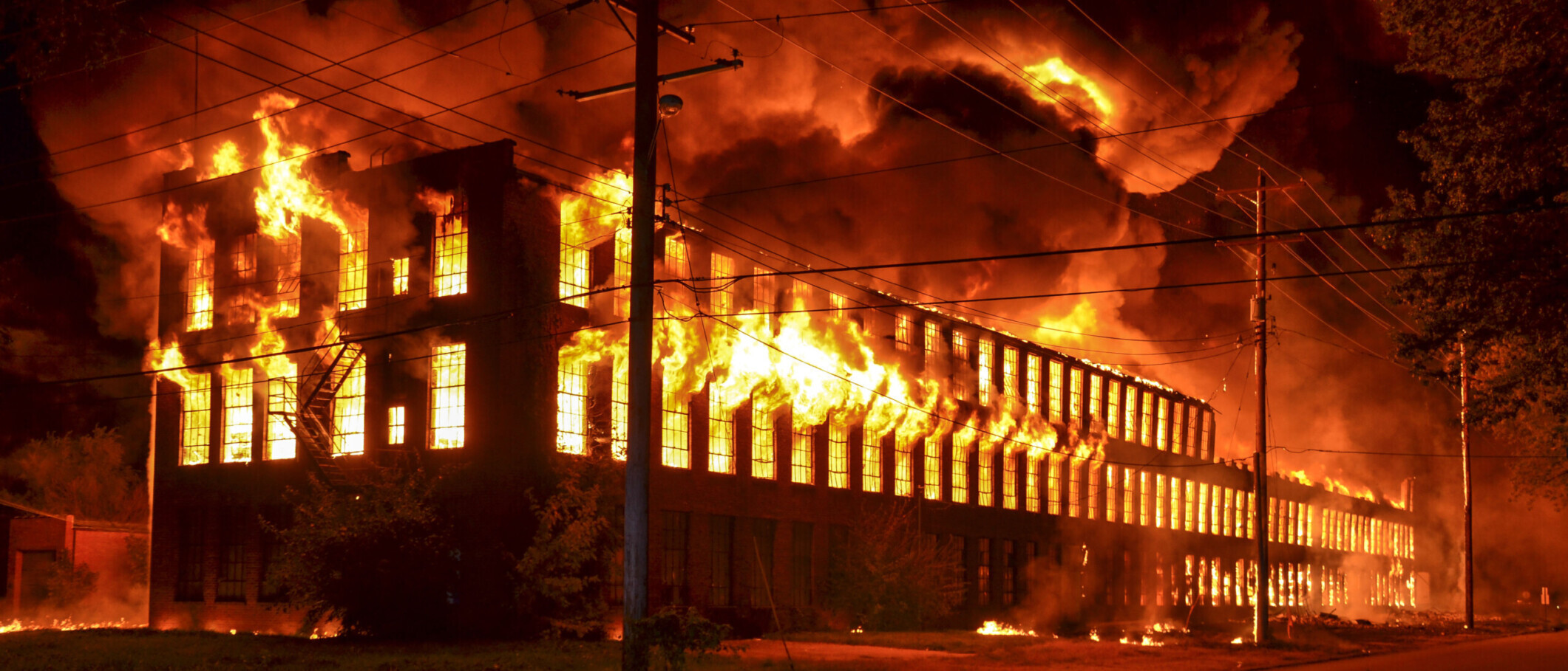 Old factory on fire at night