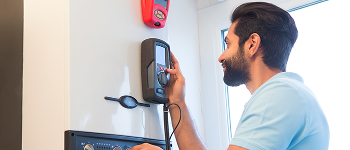 A person setting up a home heating system.